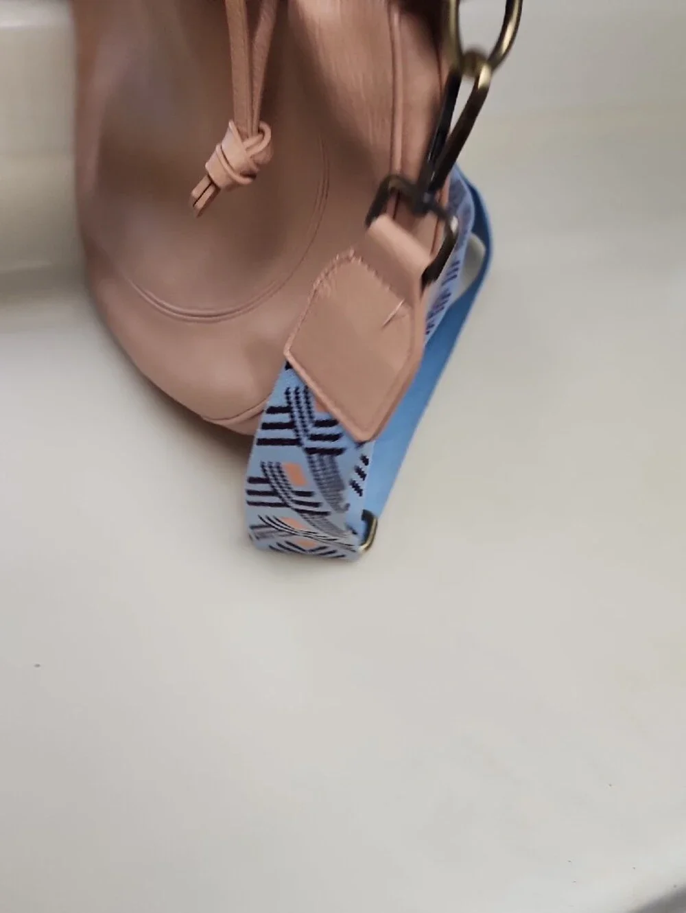 Urban Originals Peach Crescent Crossbody with Patterned Blue Strap